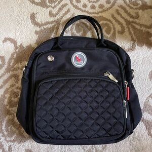 Black Quilted New Diaper bag.  Nice storage for bottles inside and stylish look.